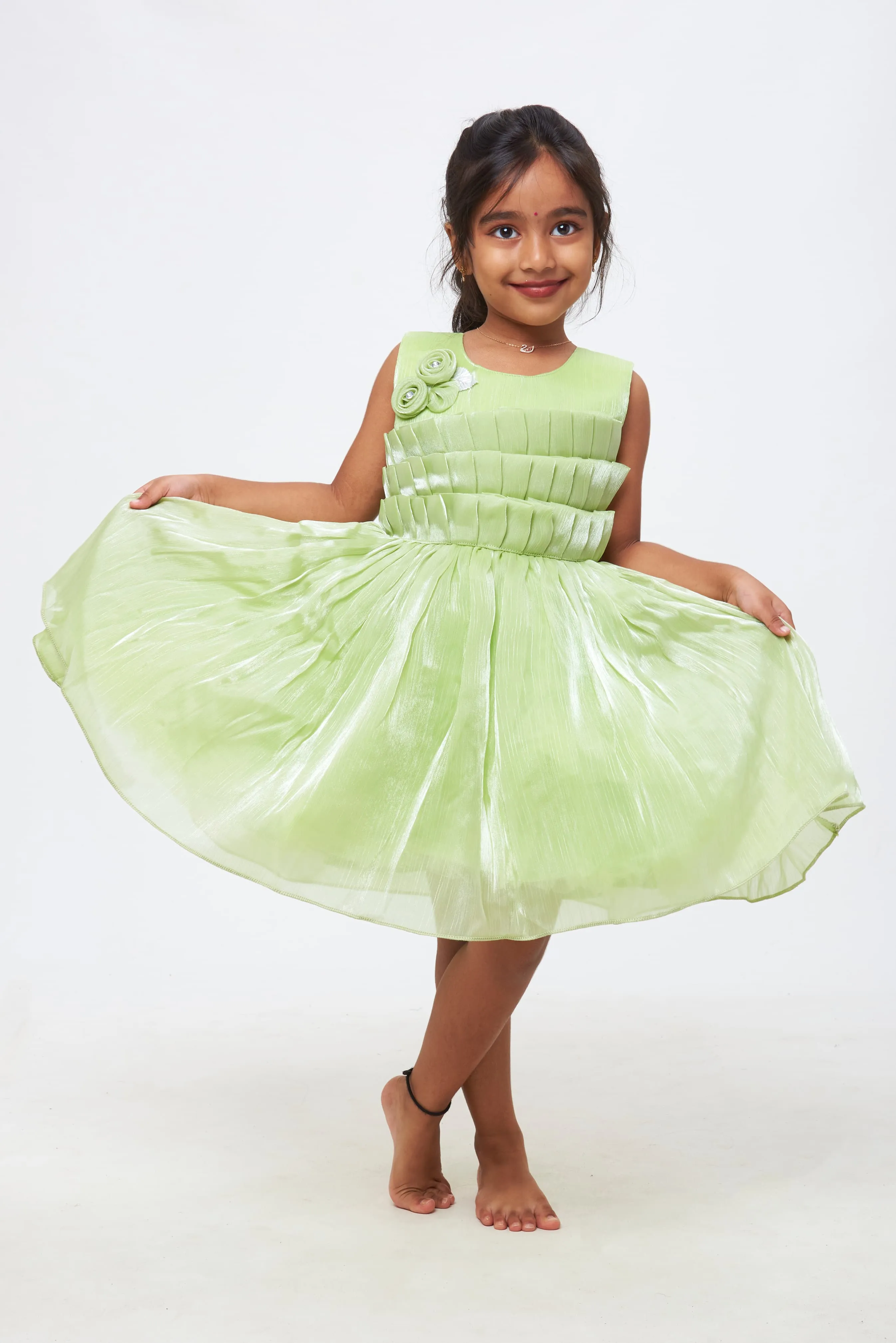 Emerald Enchantment: Girls Soft Green Tulle Dress with Rosette Accents